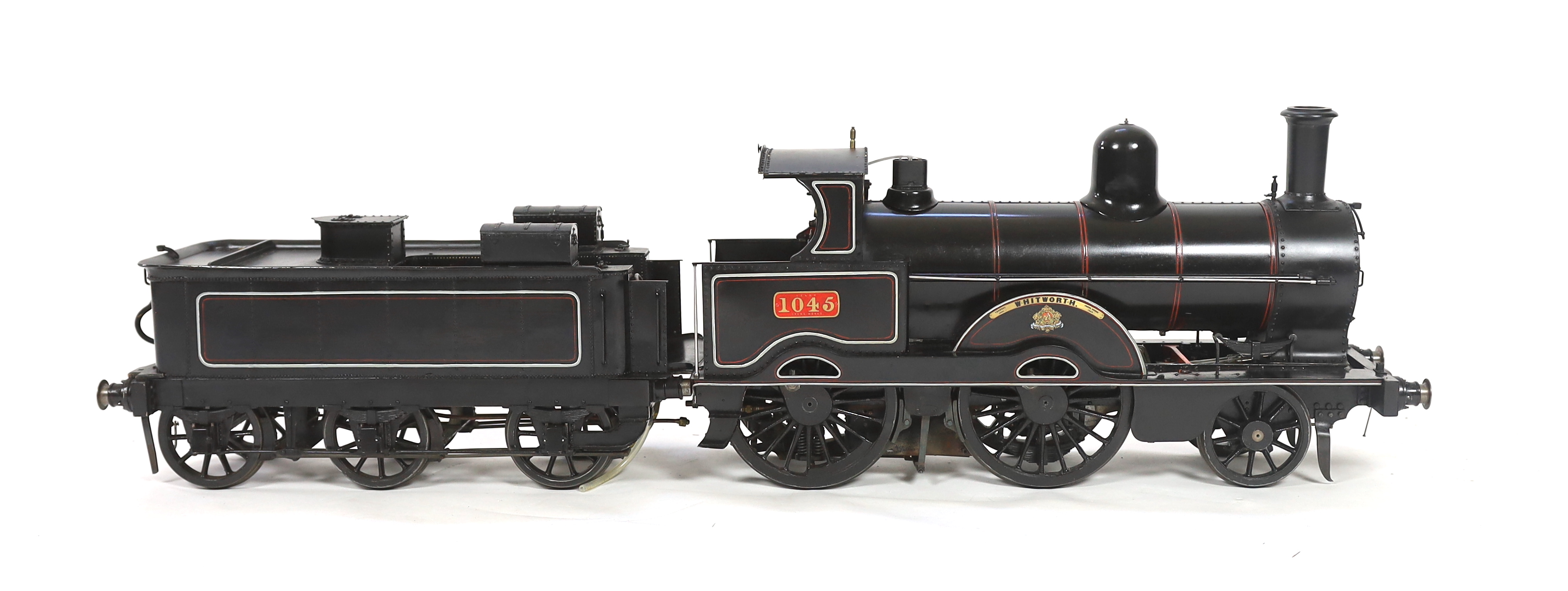 A very finely engineered scratch-built 5” gauge live steam model of a LNWR (London and North Western Railway) Jumbo 2-4-0 tender locomotive, No. 1045 ‘Whitworth’